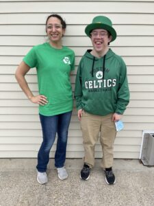 TCI staff member and client in green for Saint Patrick's Day