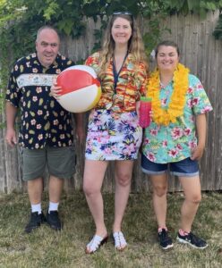 Three people in Hawaiian outfits for Spirit Week