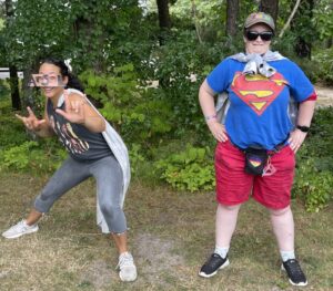 Two people in superhero costumes for Spirit Week